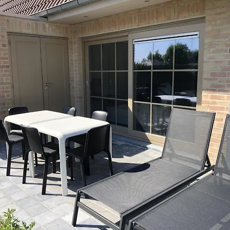 Bright Family With Bikes De Panne